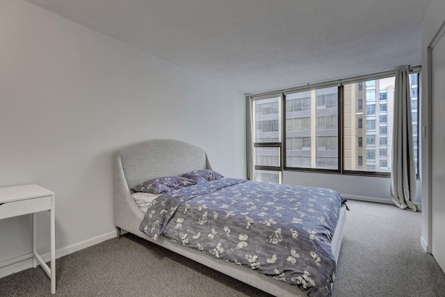carpeted bedroom with baseboards