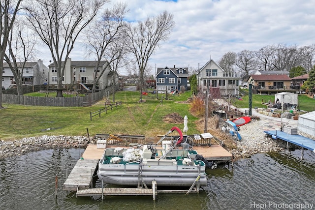 36603 N Iola Ave, Ingleside, IL 60041 - view of dock with a residential view, a lawn, a water view, and fence