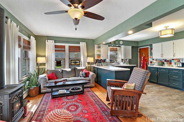 36603 N Iola Ave, Ingleside, IL 60041 - living room with a wood stove and a ceiling fan