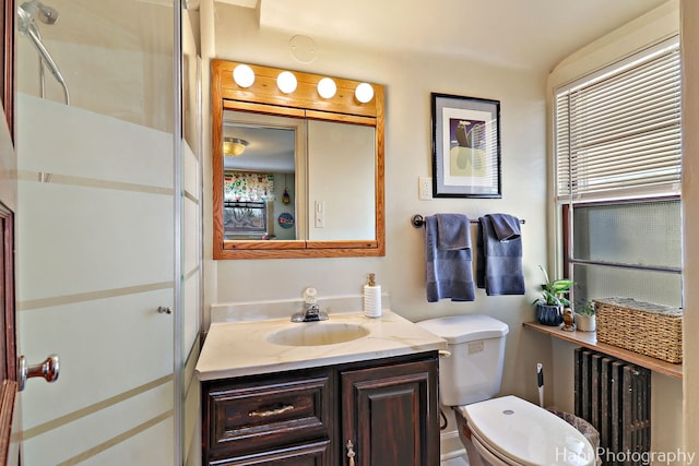 36603 N Iola Ave, Ingleside, IL 60041 - bathroom with toilet, radiator heating unit, vanity, and a shower with shower door