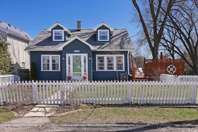 36603 N Iola Ave, Ingleside, IL 60041 - view of front of property featuring a deck, a chimney, roof with shingles, and a fenced front yard