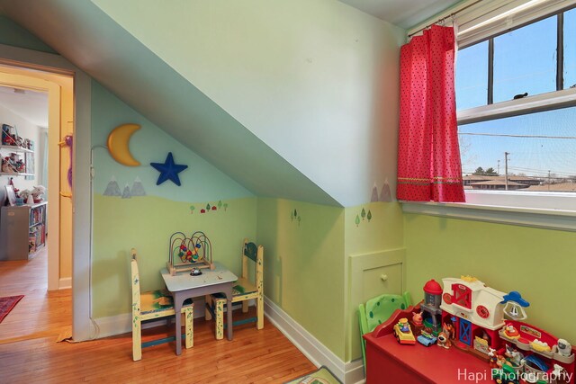 36603 N Iola Ave, Ingleside, IL 60041 - recreation room featuring wood finished floors, lofted ceiling, and baseboards