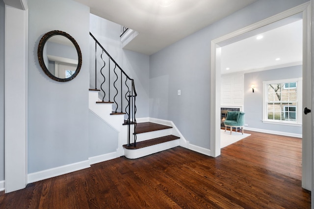195 Lakeside Pl, Highland Park, IL 60035 - stairs featuring a glass covered fireplace, recessed lighting, baseboards, and wood finished floors
