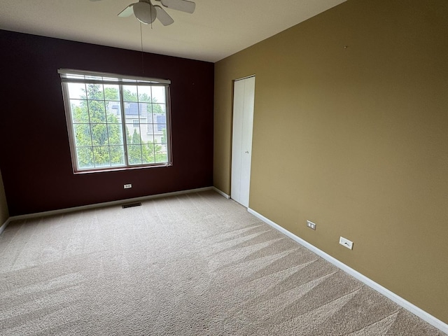 1314 Sandhurst Ln Unit 1314, South Elgin, IL 60177 - empty room featuring ceiling fan, light carpet, and baseboards