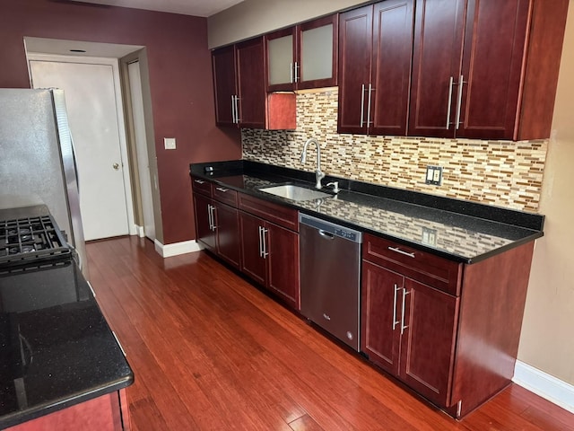 1314 Sandhurst Ln Unit 1314, South Elgin, IL 60177 - kitchen with appliances with stainless steel finishes, a sink, baseboards, dark wood-type flooring, and tasteful backsplash