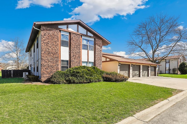 4130 192nd Ct Unit 222, Country Club Hills, IL 60478 - view of front facade featuring a front yard, fence, stone siding, and concrete driveway