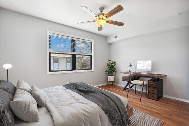 4130 192nd Ct Unit 222, Country Club Hills, IL 60478 - bedroom featuring ceiling fan, visible vents, baseboards, and wood finished floors