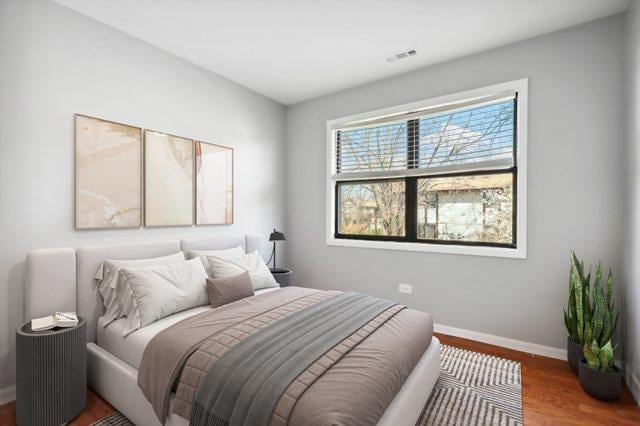 4130 192nd Ct Unit 222, Country Club Hills, IL 60478 - bedroom featuring wood finished floors, baseboards, and visible vents