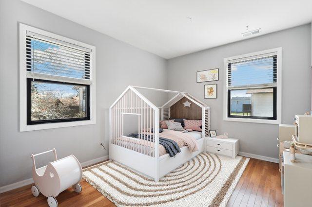 4130 192nd Ct Unit 222, Country Club Hills, IL 60478 - bedroom featuring visible vents, baseboards, and hardwood / wood-style floors