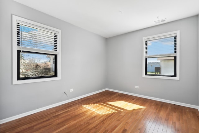 4130 192nd Ct Unit 222, Country Club Hills, IL 60478 - unfurnished room featuring wood-type flooring, visible vents, and baseboards