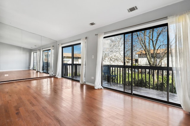 4130 192nd Ct Unit 222, Country Club Hills, IL 60478 - spare room with wood finished floors, baseboards, and visible vents