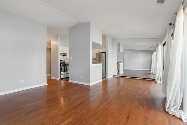 4130 192nd Ct Unit 222, Country Club Hills, IL 60478 - unfurnished living room with dark wood-style floors, baseboards, visible vents, and lofted ceiling
