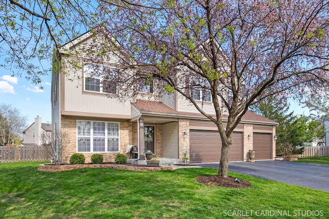 view of front of property featuring stone siding, driveway, and a garage