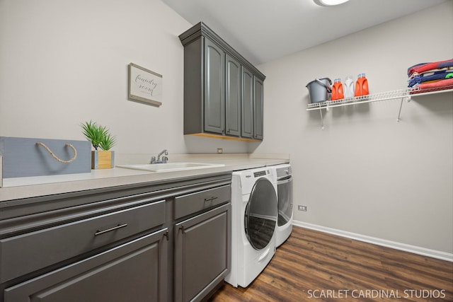 laundry room featuring dark wood-style flooring, independent washer and dryer, baseboards, and cabinet space