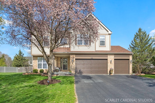 traditional home with driveway, stone siding, roof with shingles, a garage, and an attached garage