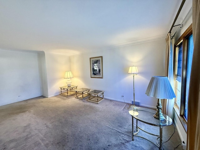 unfurnished room with baseboards, visible vents, and carpet floors