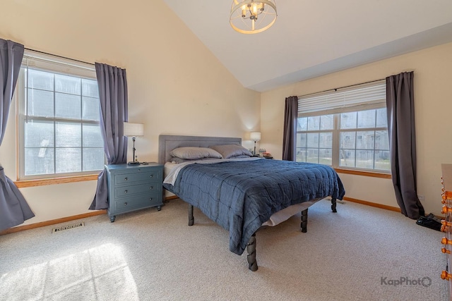 bedroom featuring light colored carpet, vaulted ceiling, visible vents, a chandelier, and baseboards