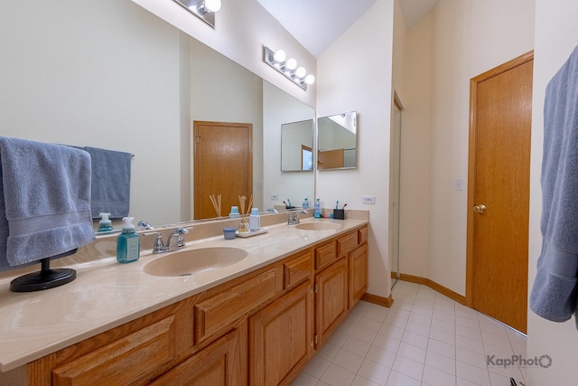 full bathroom with a sink, double vanity, tile patterned flooring, and vaulted ceiling