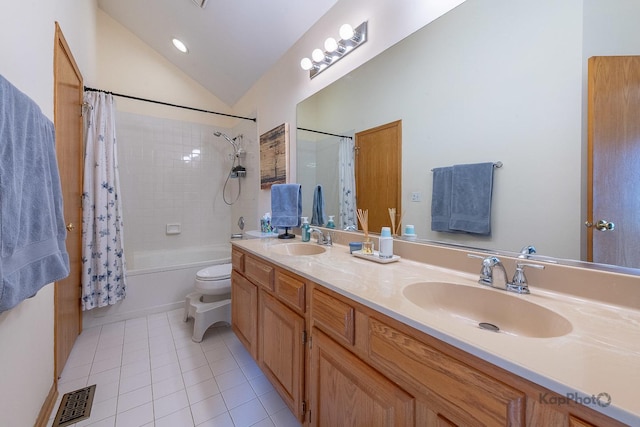 full bathroom featuring a sink, visible vents, tile patterned flooring, and lofted ceiling