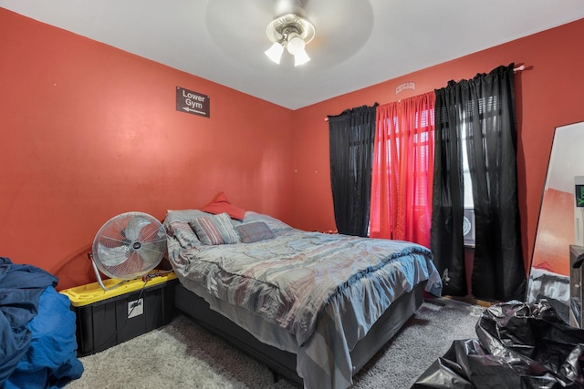 carpeted bedroom featuring ceiling fan