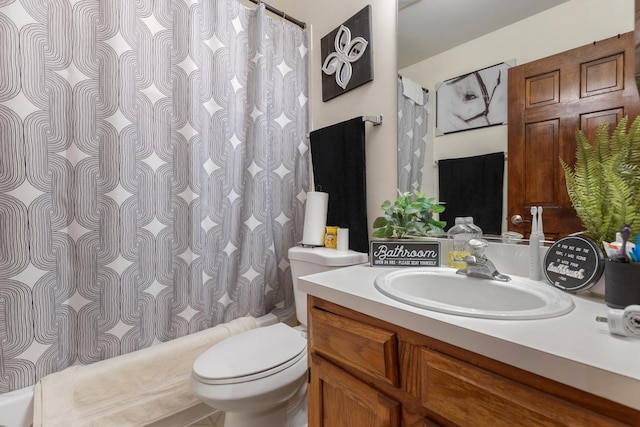 full bathroom with vanity, curtained shower, and toilet