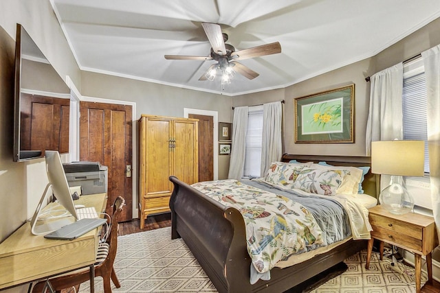 bedroom featuring ornamental molding, light wood-style flooring, and ceiling fan