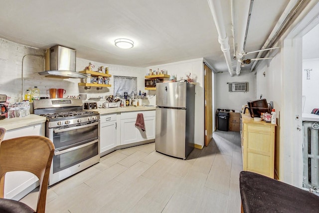 kitchen with white cabinets, open shelves, wall chimney exhaust hood, light countertops, and appliances with stainless steel finishes
