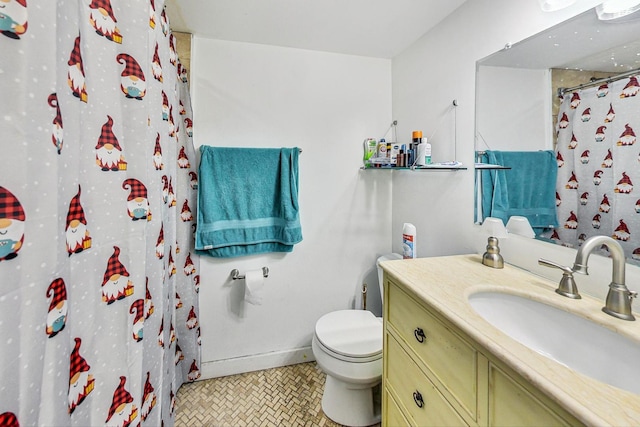 bathroom with baseboards, curtained shower, toilet, vanity, and tile patterned floors