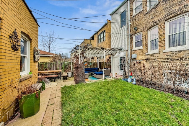 view of yard with a patio area, an outdoor living space, fence, and a pergola
