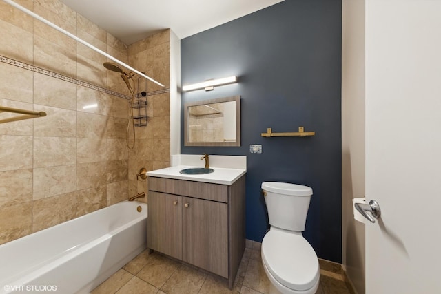 full bath featuring bathtub / shower combination, vanity, toilet, tile patterned floors, and baseboards