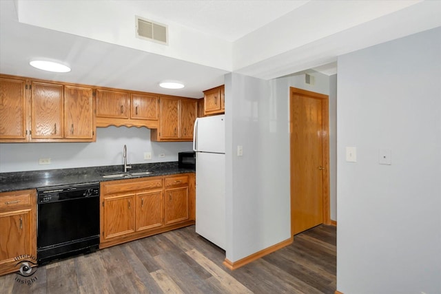 4920 134th Ct Unit 205, Crestwood, IL 60418 - kitchen with black appliances, a sink, dark wood-style floors, and dark countertops