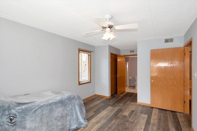 empty room featuring baseboards, a ceiling fan, and wood finished floors