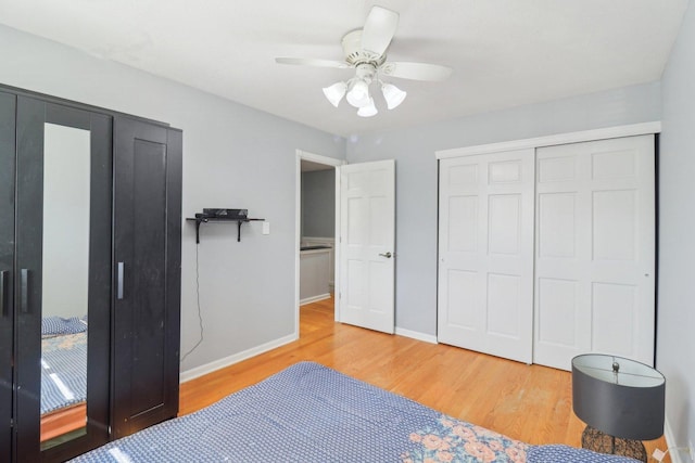 bedroom with a closet, light wood finished floors, baseboards, and a ceiling fan