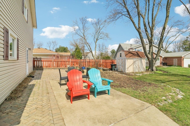 exterior space with a shed, a patio, a fenced backyard, and an outdoor structure