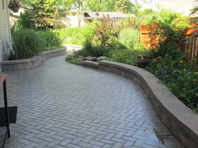 view of home's community featuring a patio area
