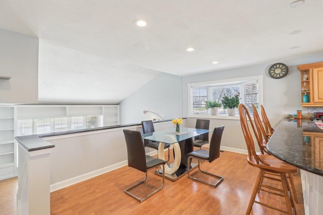 dining area with recessed lighting, light wood-style floors, and baseboards