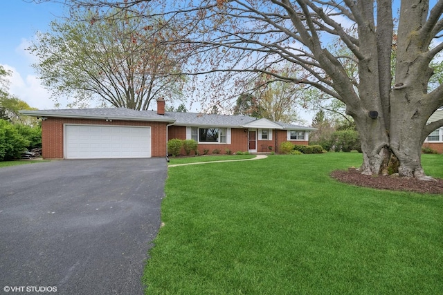 1112 N Perry Dr, Palatine, IL 60067 - ranch-style home featuring driveway, an attached garage, a chimney, a front lawn, and brick siding