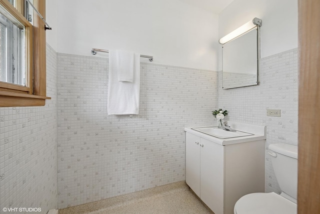1112 N Perry Dr, Palatine, IL 60067 - bathroom with vanity, toilet, tile walls, and wainscoting