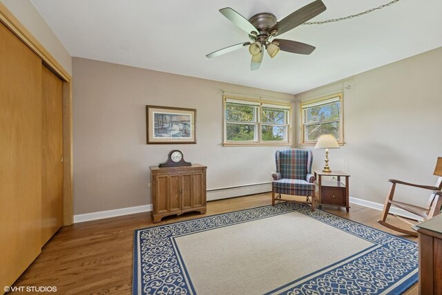 1112 N Perry Dr, Palatine, IL 60067 - living area featuring a baseboard heating unit, wood finished floors, and ceiling fan
