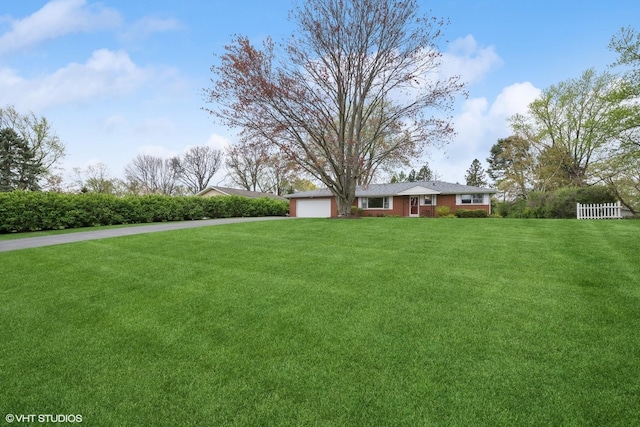1112 N Perry Dr, Palatine, IL 60067 - view of grassy yard featuring driveway and a garage