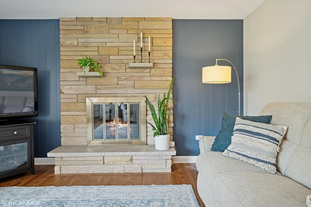 1112 N Perry Dr, Palatine, IL 60067 - living area featuring a fireplace, wood finished floors, baseboards, and wood walls