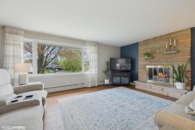 1112 N Perry Dr, Palatine, IL 60067 - living area with a baseboard heating unit, wood finished floors, and a fireplace