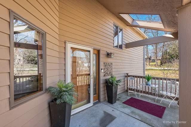view of exterior entry featuring a porch