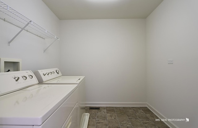 2850 Cattail Ct Unit C, Wauconda, IL 60084 - laundry room with washer and dryer and stone finish flooring