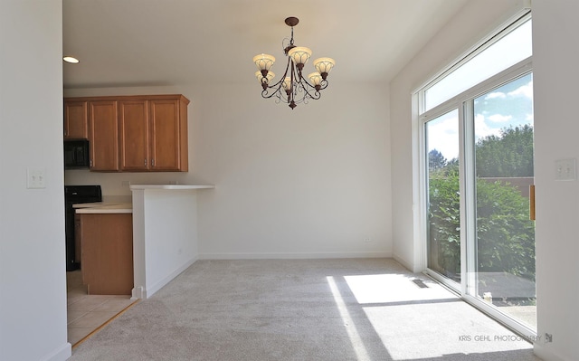 2850 Cattail Ct Unit C, Wauconda, IL 60084 - unfurnished dining area with a chandelier and light colored carpet