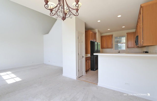 2850 Cattail Ct Unit C, Wauconda, IL 60084 - kitchen with freestanding refrigerator, light colored carpet, recessed lighting, light countertops, and a chandelier