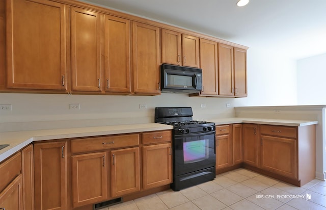 2850 Cattail Ct Unit C, Wauconda, IL 60084 - kitchen with black appliances, light countertops, brown cabinets, a peninsula, and recessed lighting