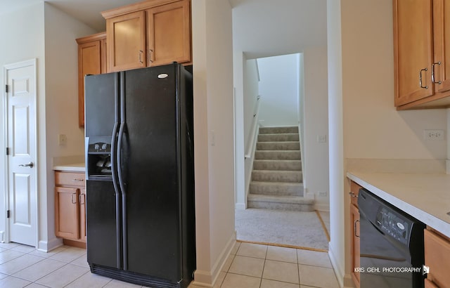 2850 Cattail Ct Unit C, Wauconda, IL 60084 - kitchen featuring black appliances, light tile patterned floors, light countertops, and light carpet