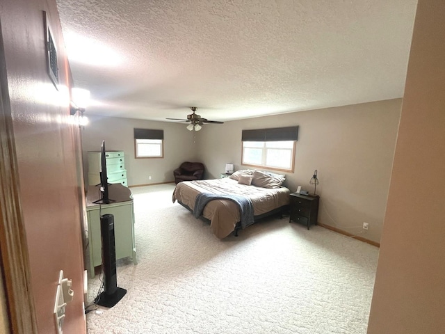 bedroom featuring carpet floors, baseboards, and ceiling fan