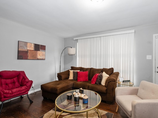 living area with wood finished floors and baseboards
